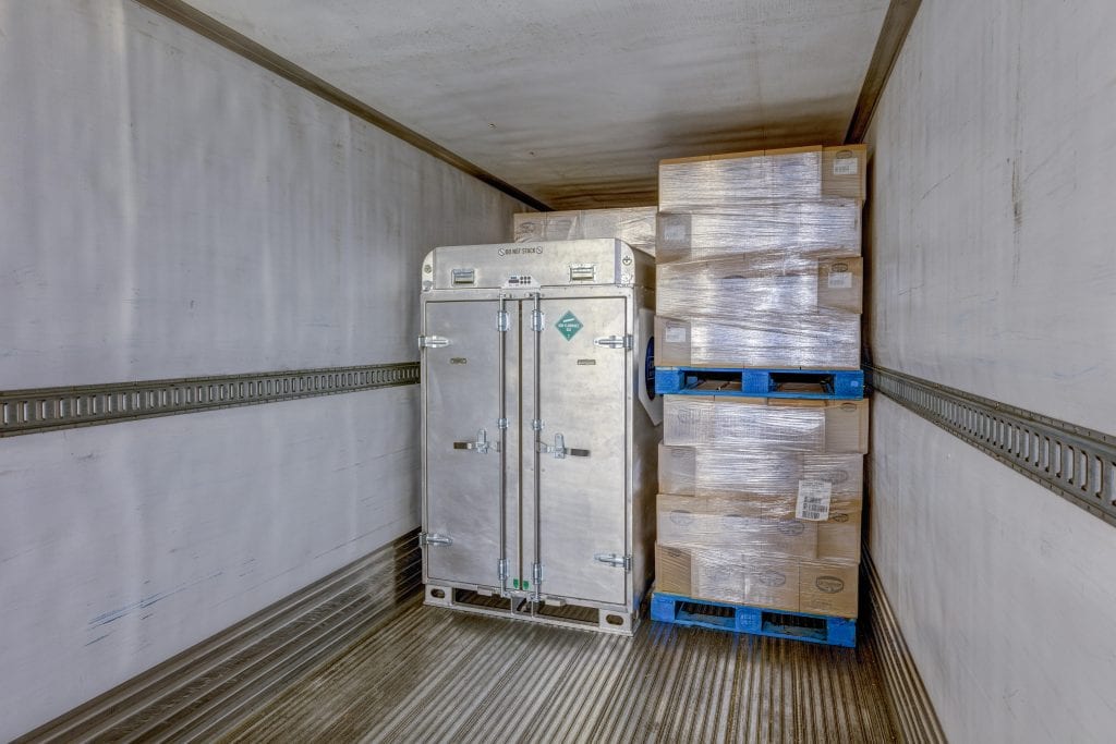 CryoLogistics SnowSHIP Unit loaded onto a truck beside palletized product